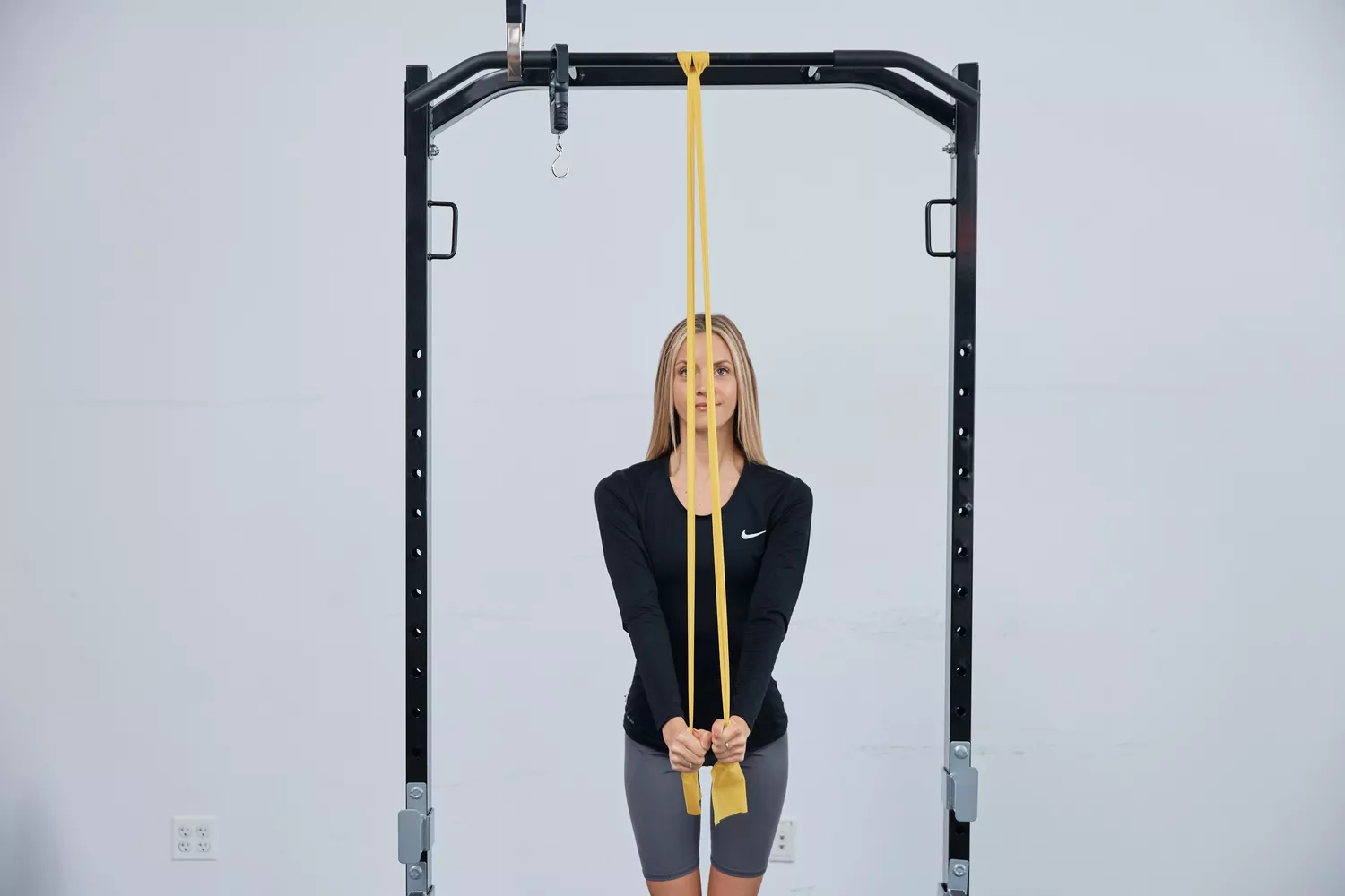 Person using Healthy Seniors Chair Exercise Program with Two Resistance Bands to work upper body