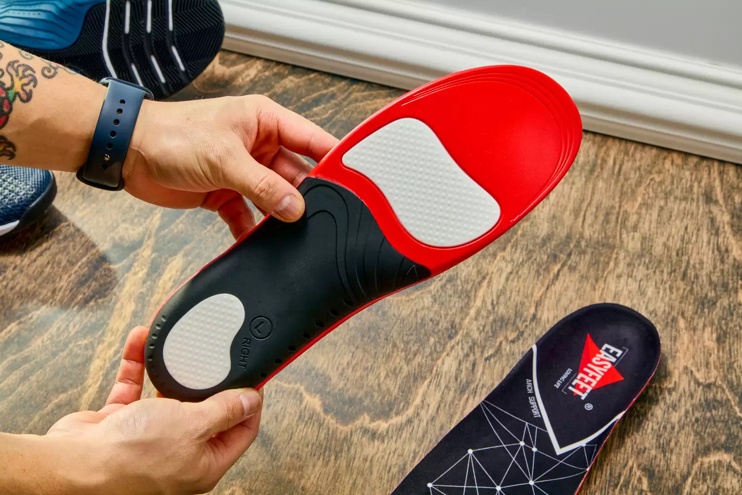 Hands holding an EasyFeet Plantar Fasciitis Arch Support Insole