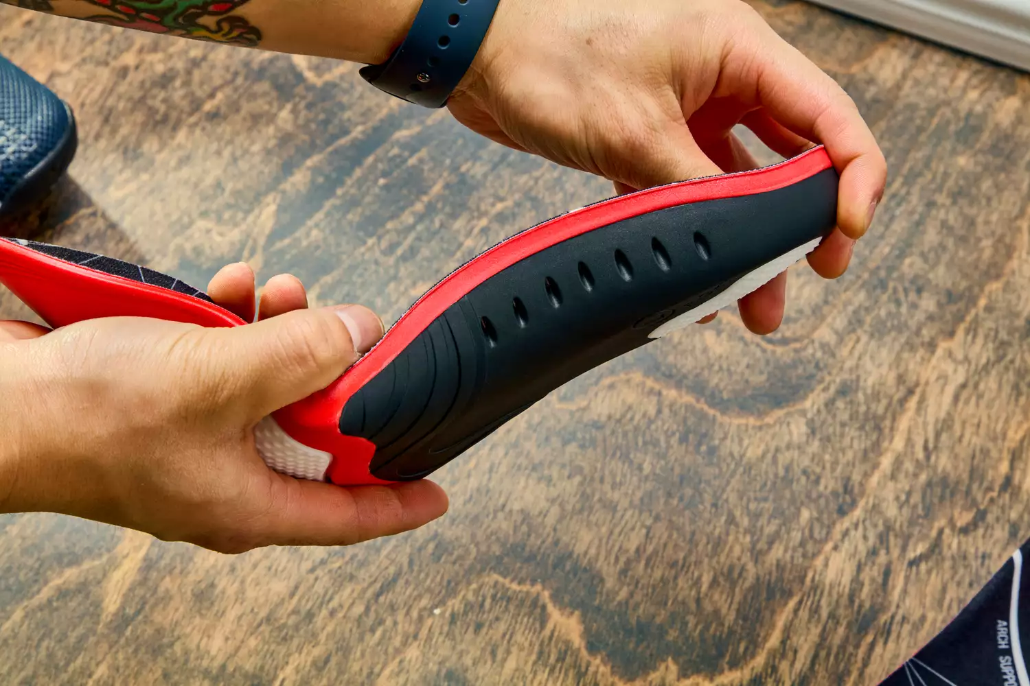 Hands bending an EasyFeet Plantar Fasciitis Arch Support Insole