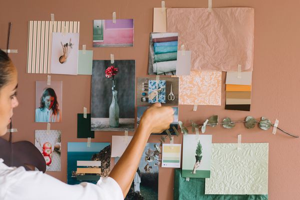 Woman organizing a vision board for home renovations