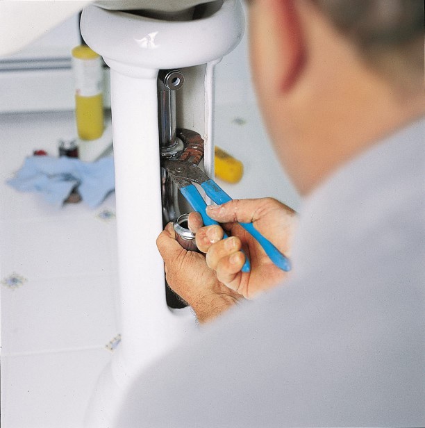 The trap of a pedestal sink is attached.