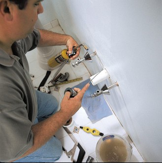 The supply lines of a pedestal sink are soldered.
