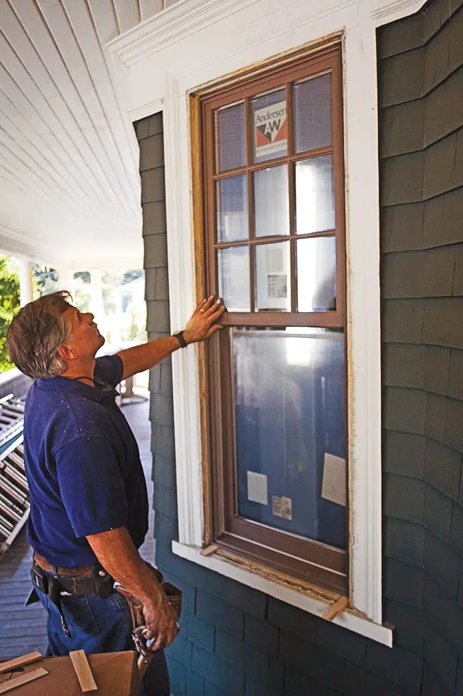 Tom Silva inspects the new replacement window.