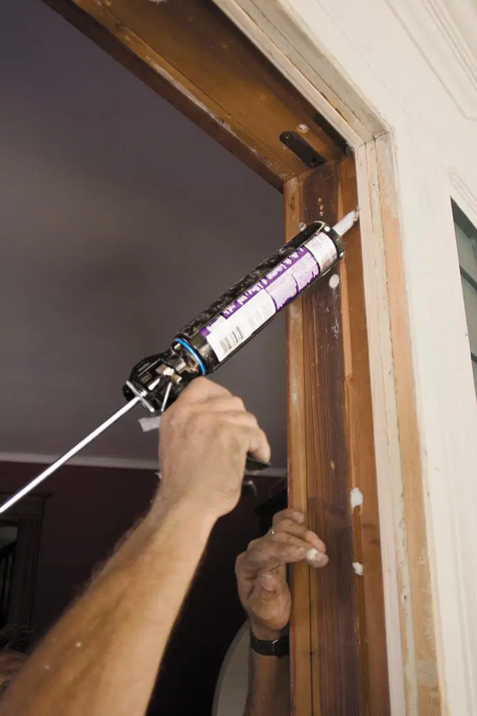 The window opening is caulked to put in the replacement window.