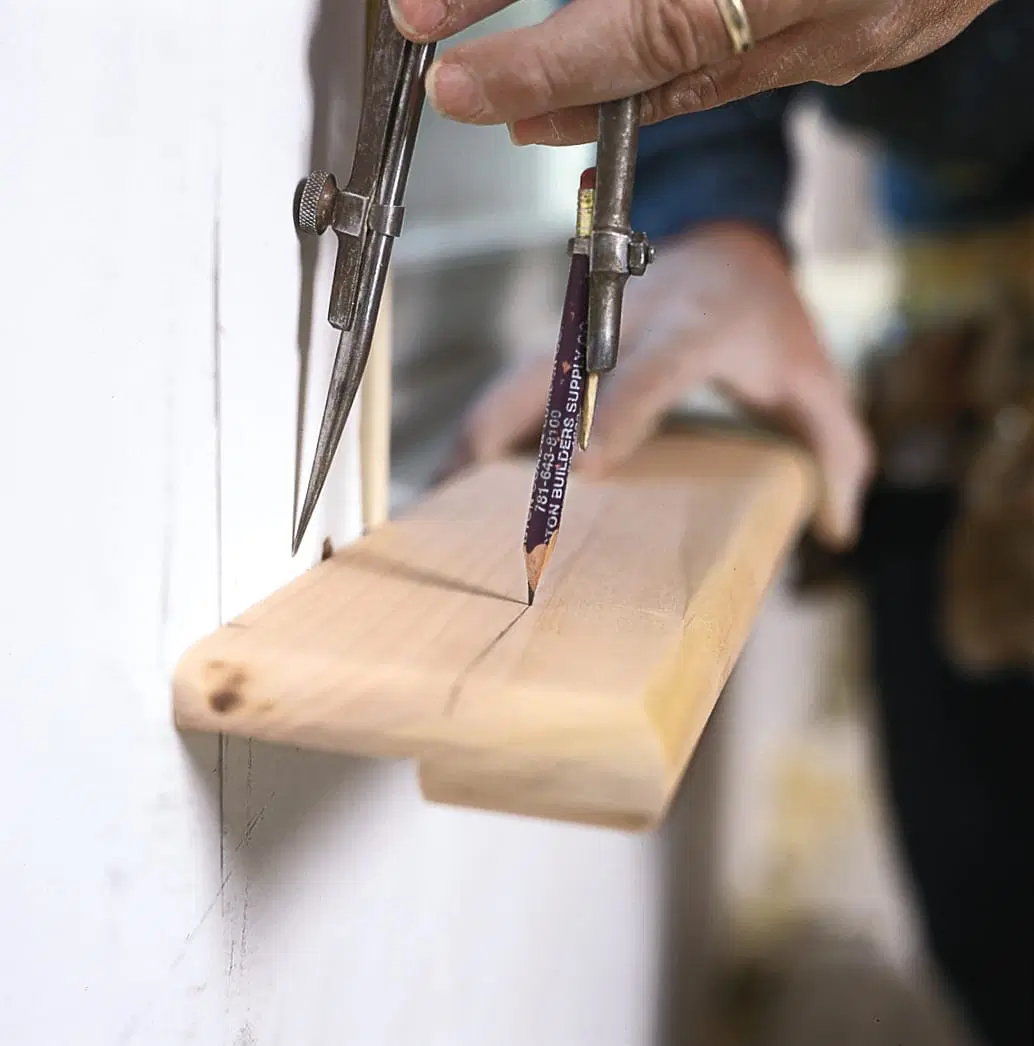 The stool is notched and installed as the third step of trimming a window.