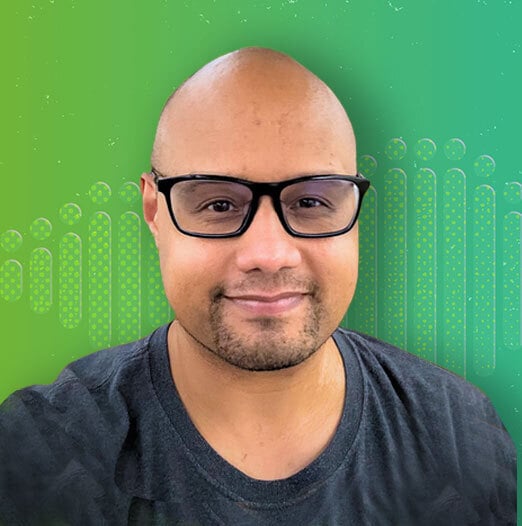 headshot of author in front of a green background
