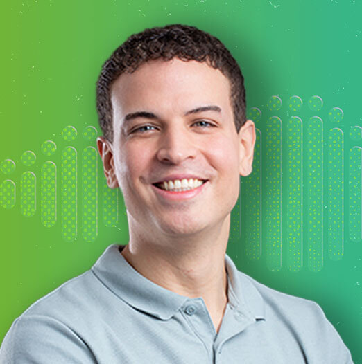 author in front of a green background