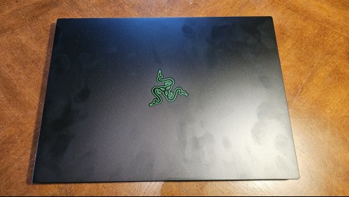 Razer Blade 14 laptop closed on a table.
