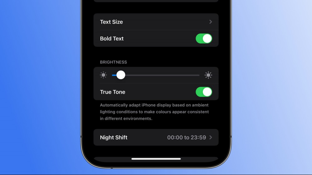 A screenshot of an iPhone against a blue gradient background, showing the Bold Text option enabled on the Display & Brightness settings page.