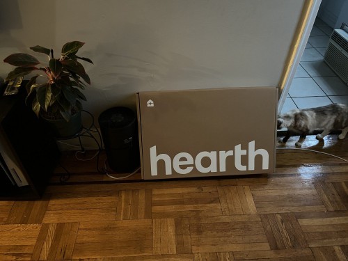 A flat delivery box with "Hearth" written on it