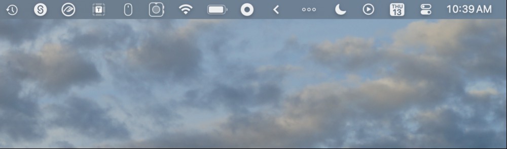 A messy menu bar. One icon is an arrow pointing left—everything to the left of it is normally hidden.