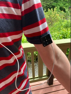 The Mighty 3 clipped to the sleeve of my striped t-shirt. 