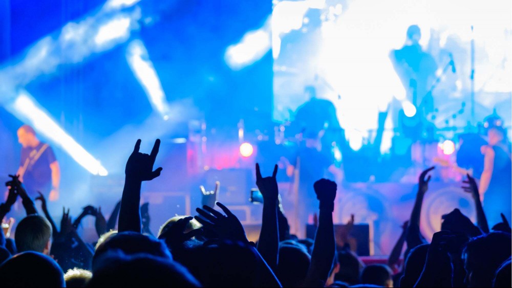 Hands raised during a rock show at a club