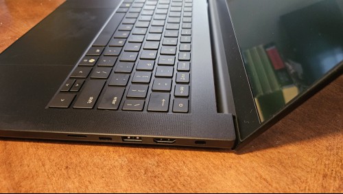 Side view of the Razer Blade 14 open on a table.