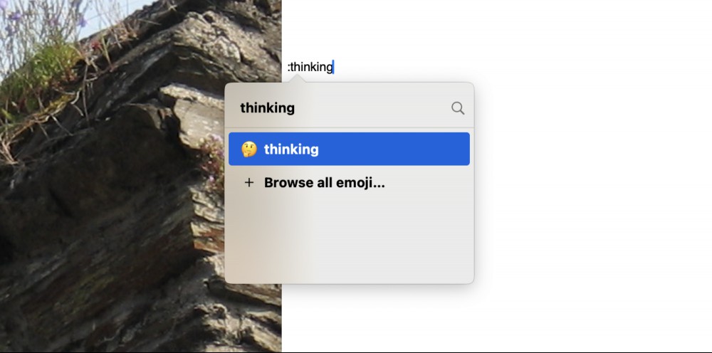 A standard text document. The user has typed a colon and the Rocket interface pops up, allowing the user to type the name of an emoji in order to insert it in the document.