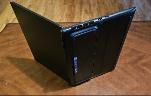 A rearview of the Alienware Aurora 16X open on its side on a tabletop.