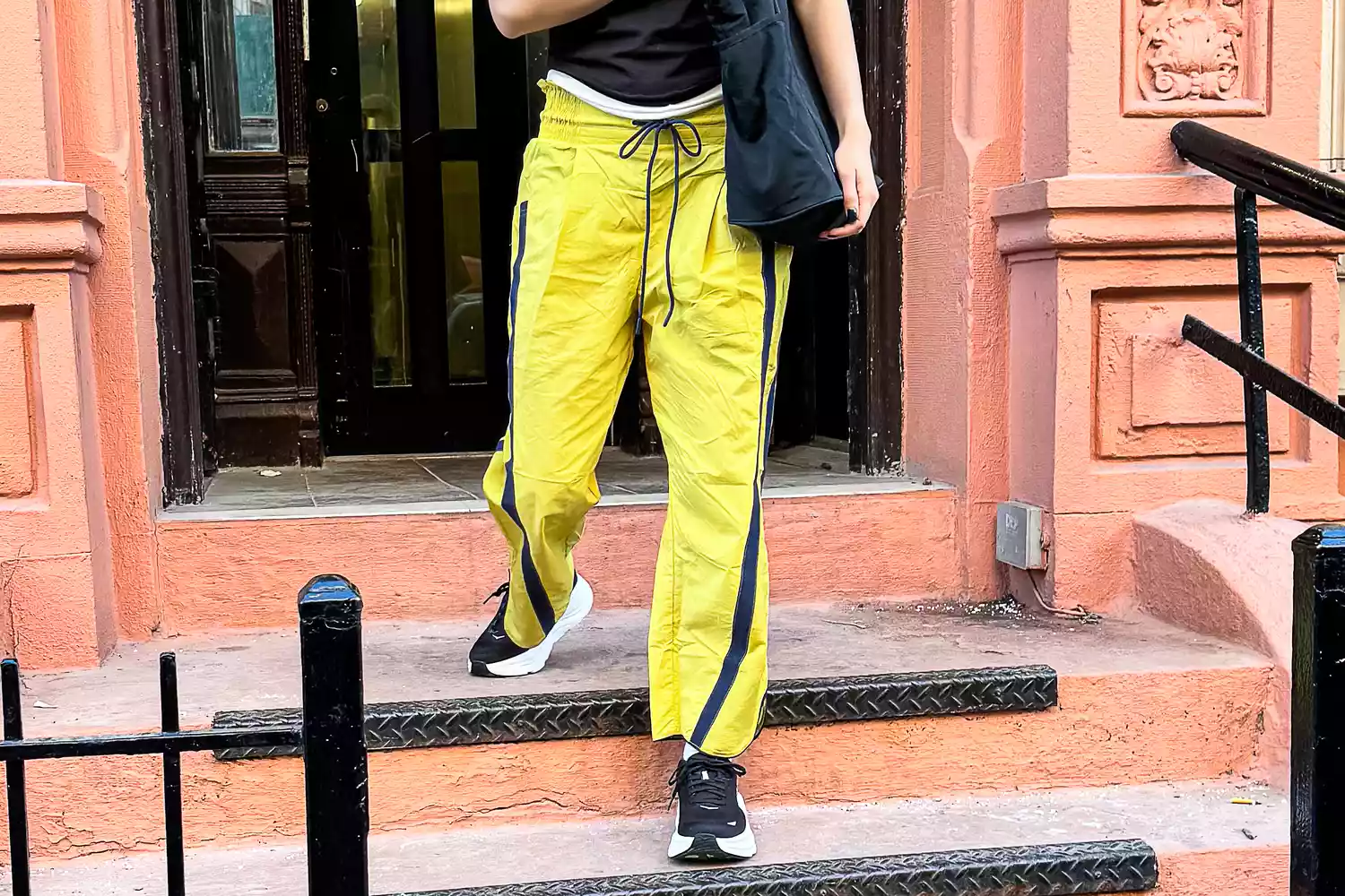 View of a woman's legs and feet wearing Hoka Bondi 9 sneakers