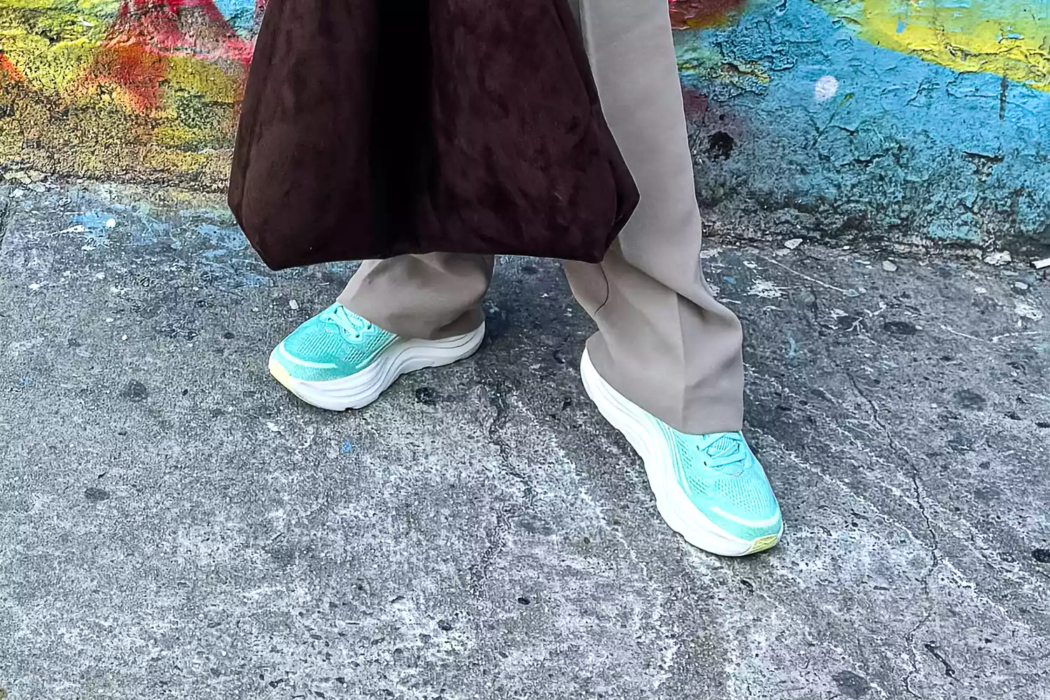 Close-up of a woman's feet wearing Hoka Bondi 9 sneakers