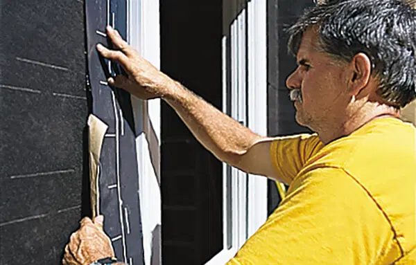 installing trim casing and caulking a new window