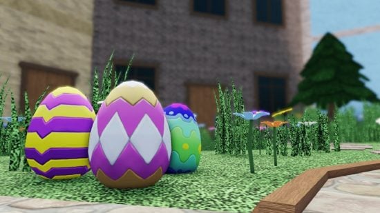 Some Easter eggs sit on a patch of grass.