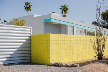 Yellow concrete blocks creating enclosed area of modern home