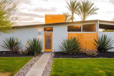 Modern home with sleek lines of orange painted doors and separators