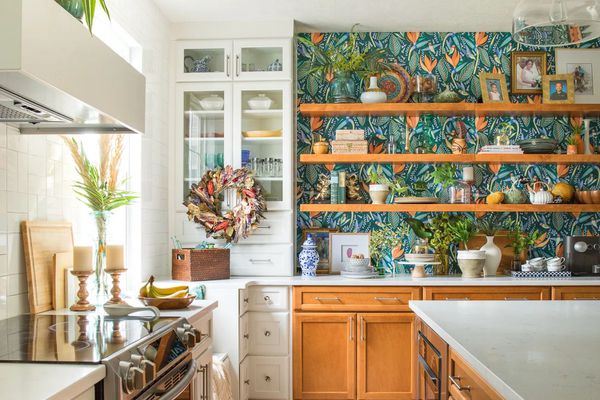 Colorful kitchen with wallpaper and floating shelves