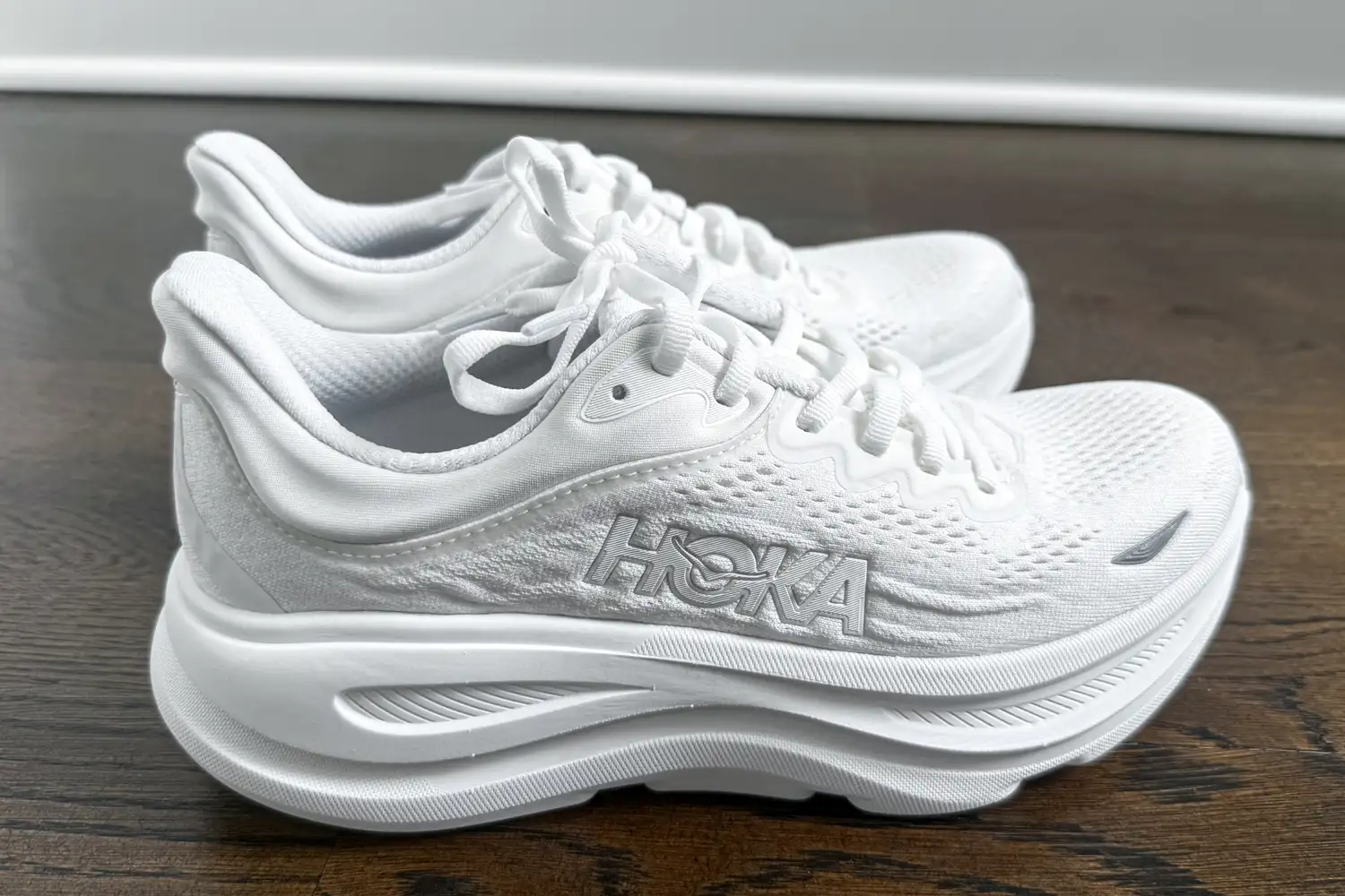 A side view of a pair of HOKA Men's Bondi 9 Running Shoes