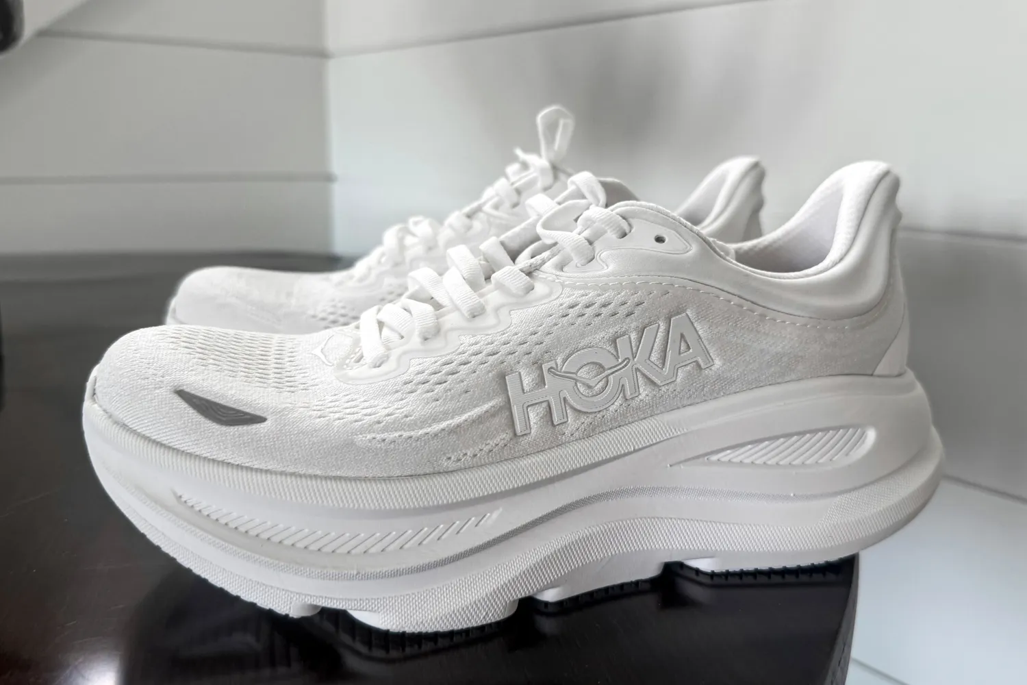 A side view of a pair of HOKA Men's Bondi 9 Running Shoes