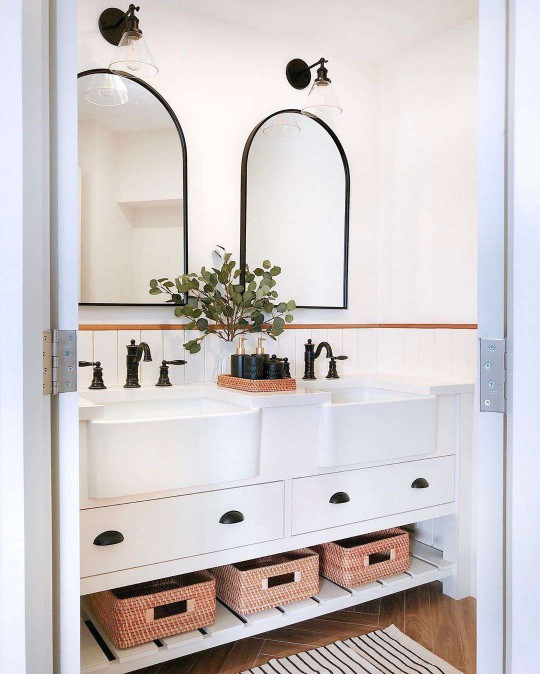 A powder room with two sinks in it