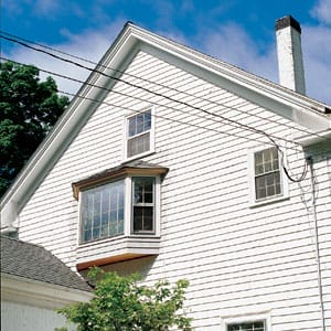A white home with a second story bay window