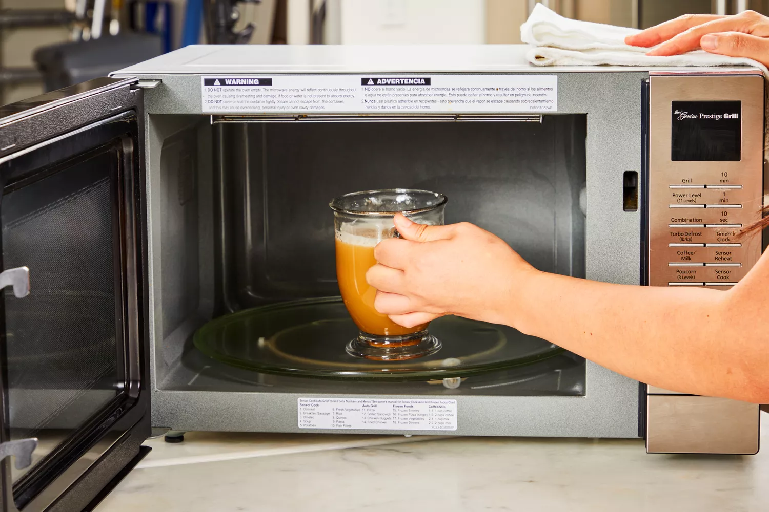 A glass of Ancient Nutrition Bone Broth Protein is placed into a microwave