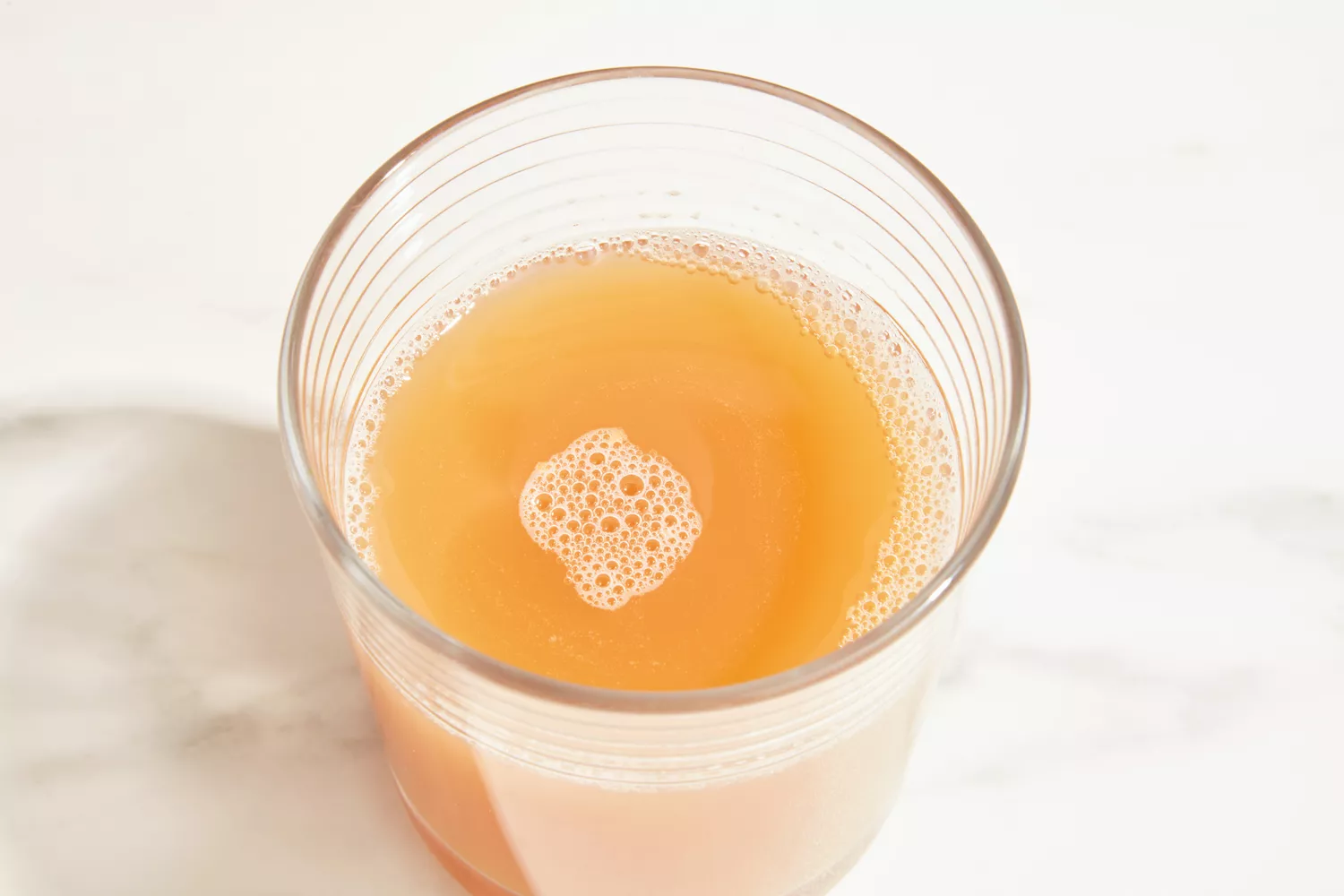 A glass of Ancient Nutrition Bone Broth Protein