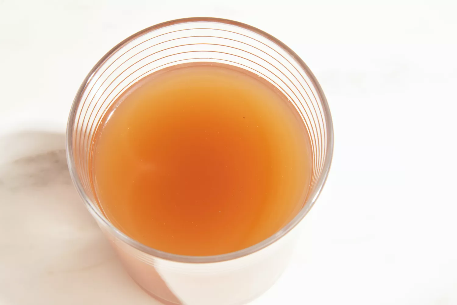 A glass of Bare Bones Grass-Fed Beef Organic Bone Broth