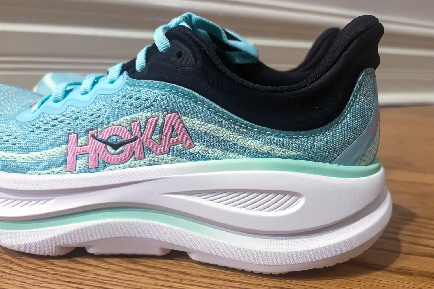 A Hoka running shoe with visible logo and cushioned sole