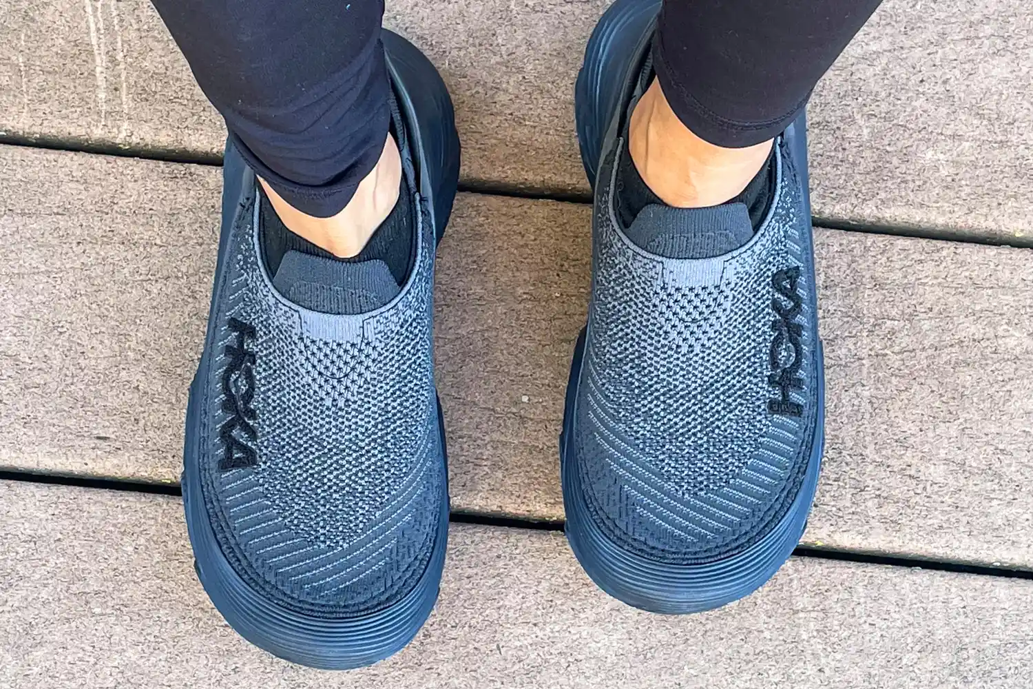 An overhead view of a person wearing the Hoka Restore TC Recovery Shoes