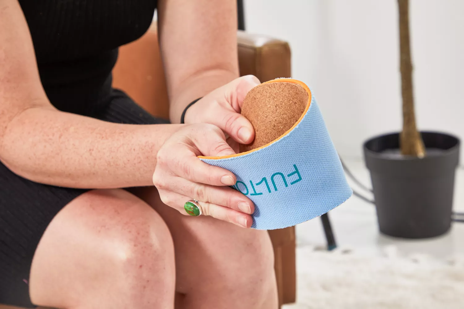 Person folding a Fulton Athletic Insole