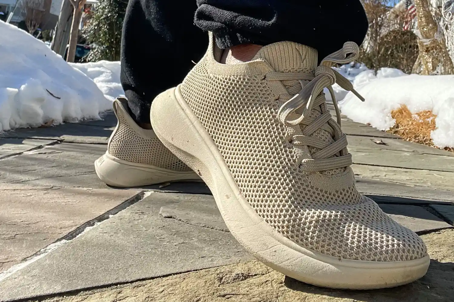 A side view of a person wearing the Vivaia Unisex Urban Sneaker Slider