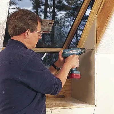 drilling drywall into the interior of the skylight