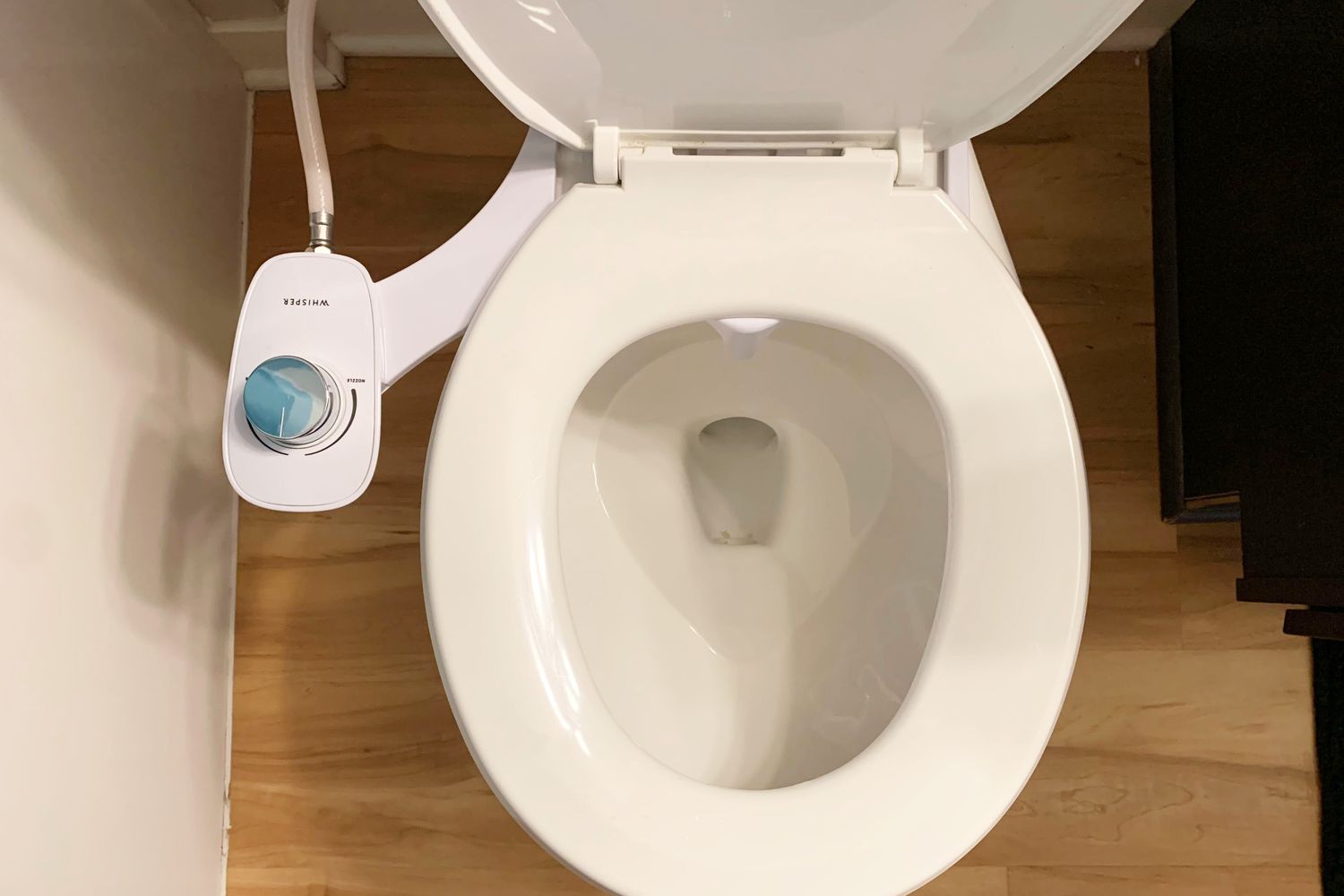 Whisper Bidet Self-Cleaning Attachment installed on a toilet