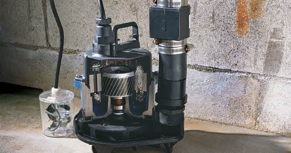 A cutaway view of a sump pump installed in a basement, showing internal components and setup.