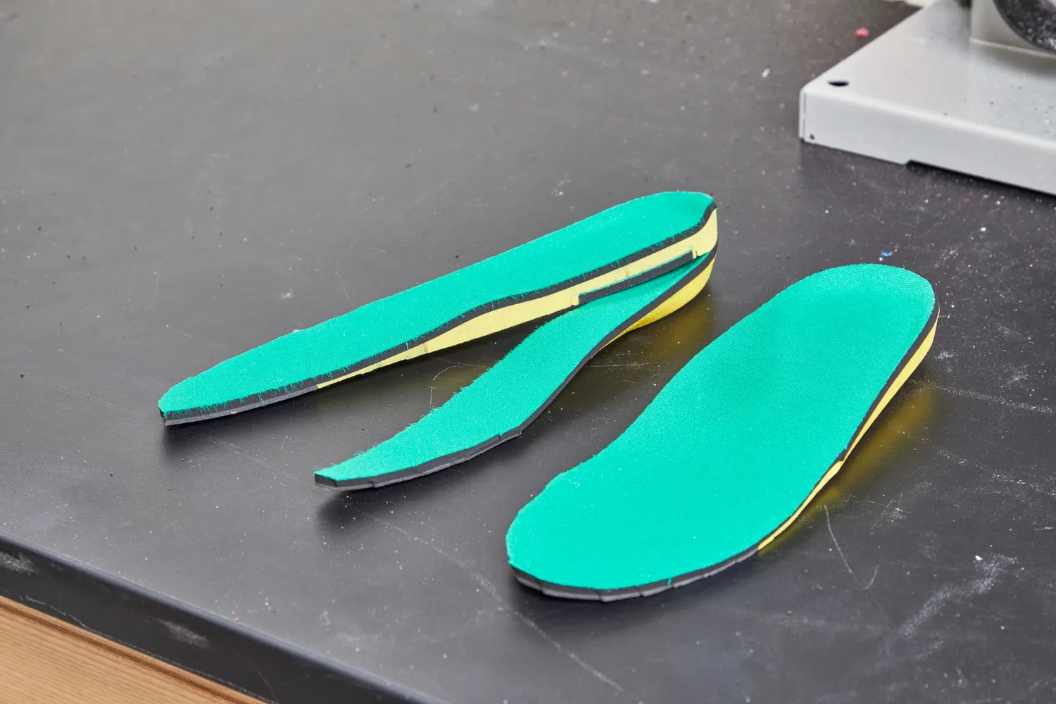 Spenco PolySorb Cross Trainer Insole displayed next to another cut in half