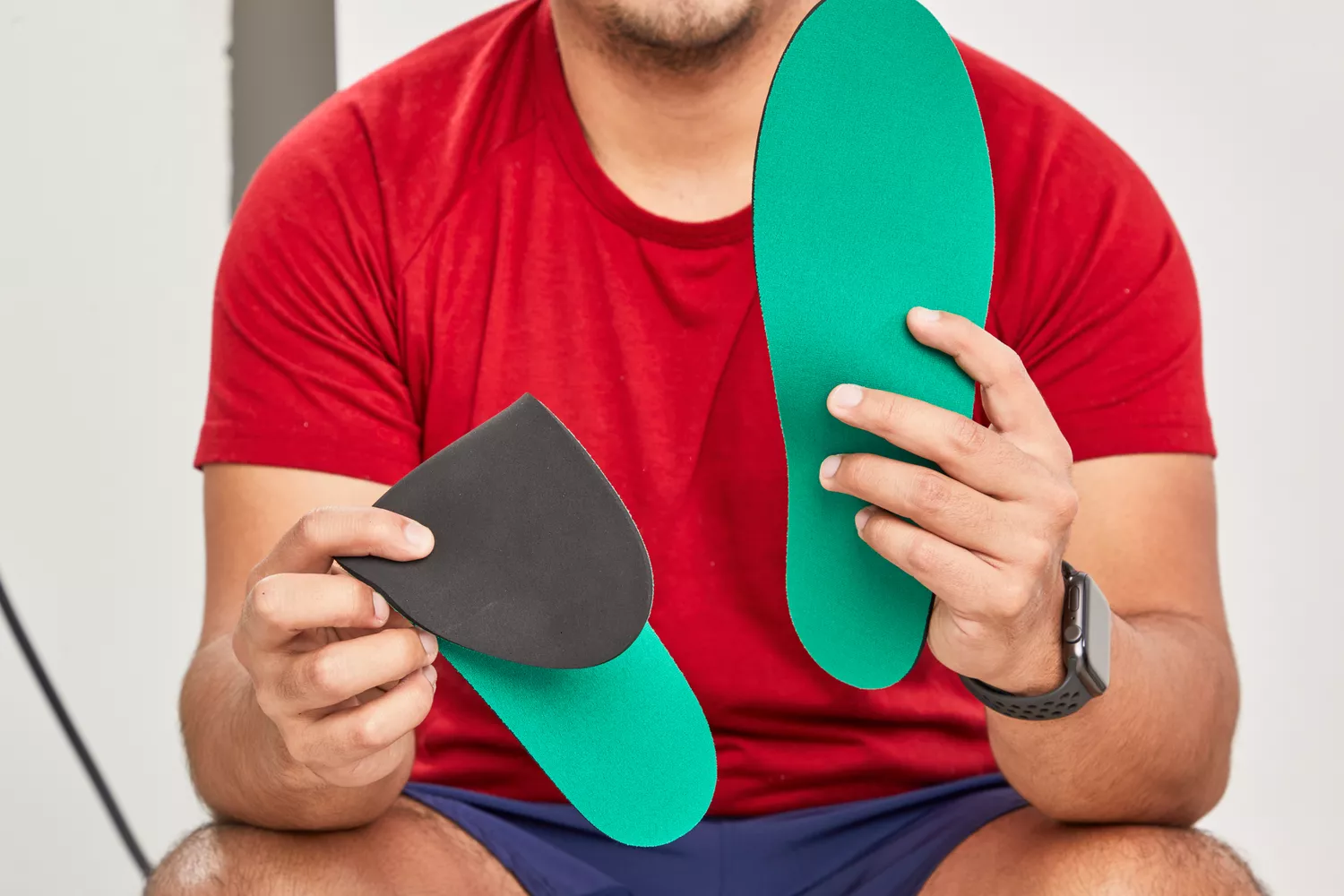 Person holding Spenco RX Comfort Insoles