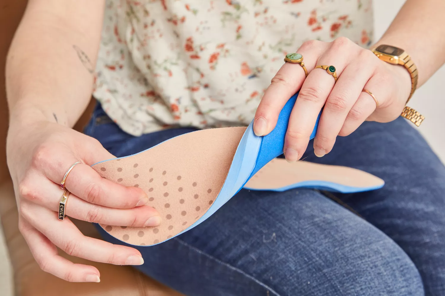 Hands twisting a Vionic Slimfit Orthotic Insole