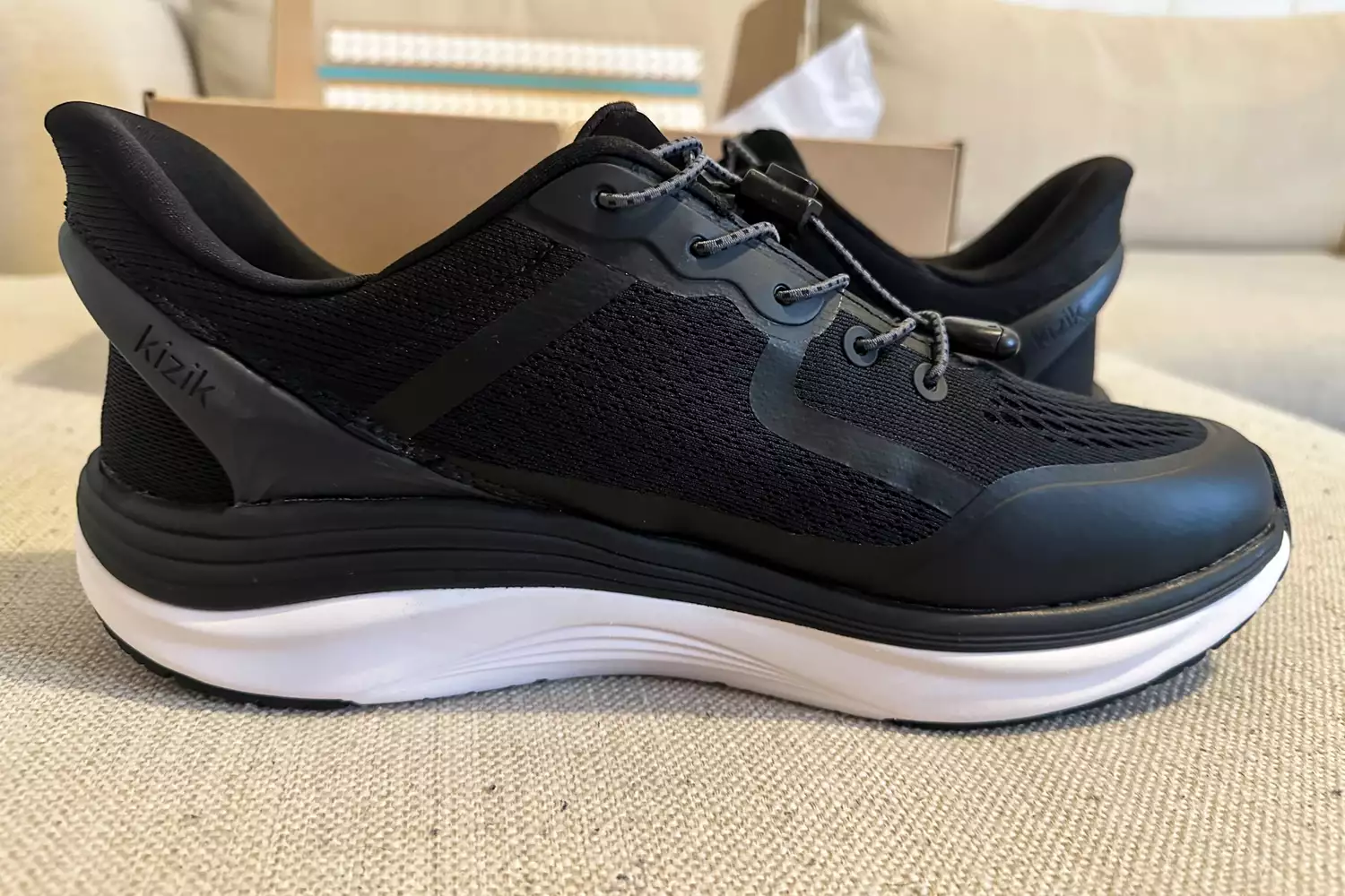 Two Kizik Men's London posed on a floor