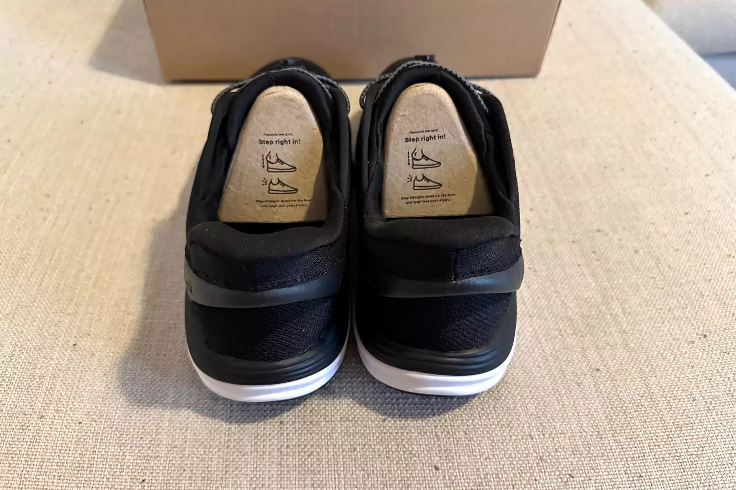 Two Kizik Men's London posed in original packaging