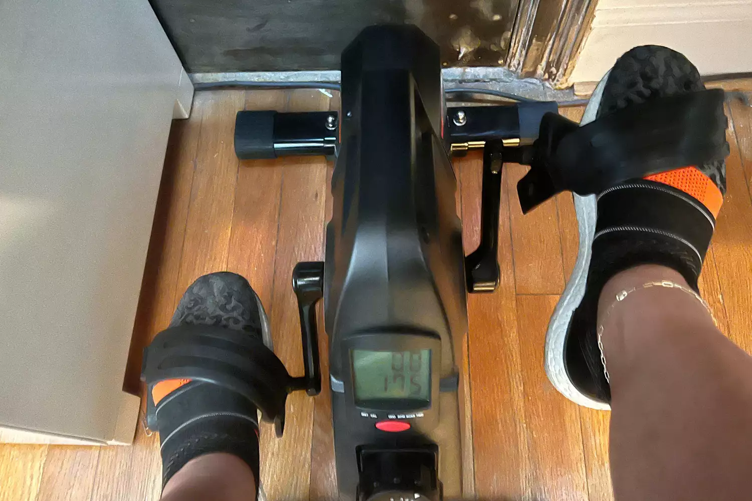 Close-up of feet in pedals of the YOSUDA Indoor Cycling Bike