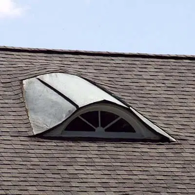Eyebrow dormer on top of a Victorian home