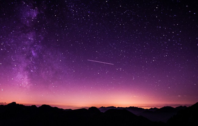 Space Name Origins: A shooting star over a mountain range
