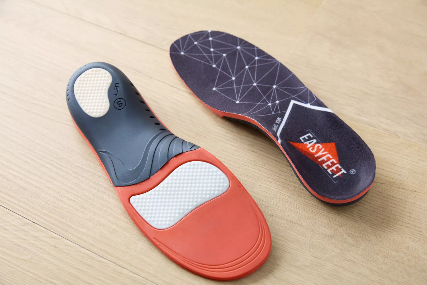 Top and bottom of EasyFeet Plantar Fasciitis Arch Support Insoles displayed on a wood surface